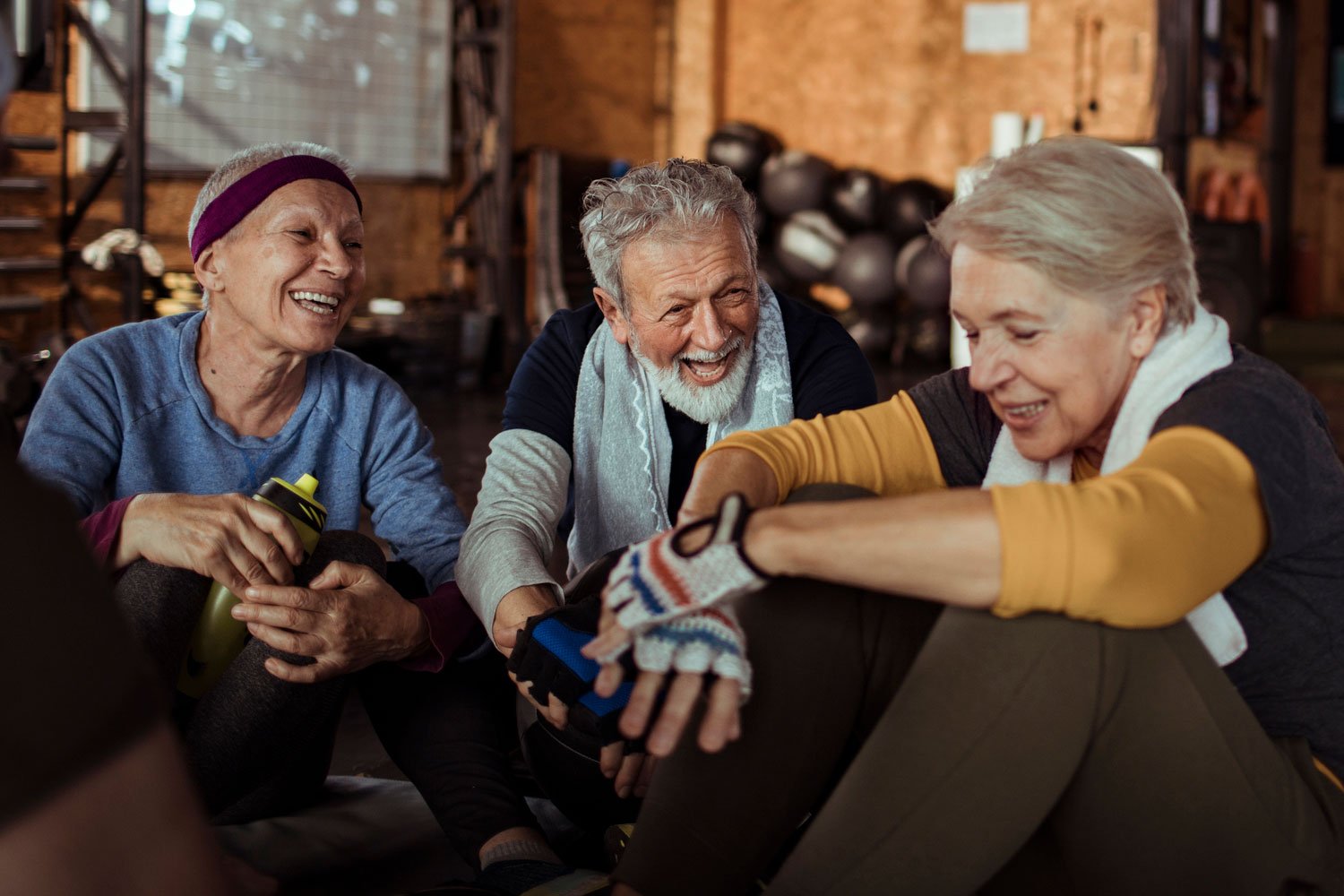 Older adults strength training in the Silver and Strong class at KJ Health Collective